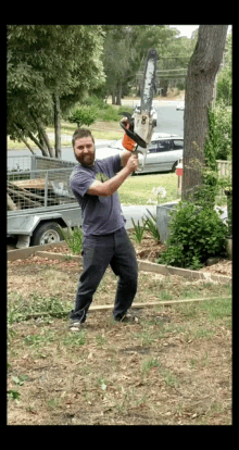 man with tree chopping machine