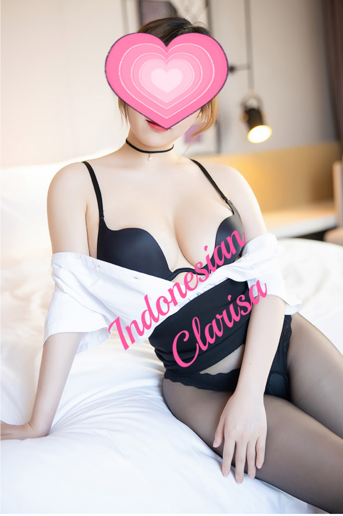 Busty Asian escort in black lingerie