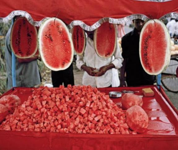 Asian stall selling huge watermelon halves