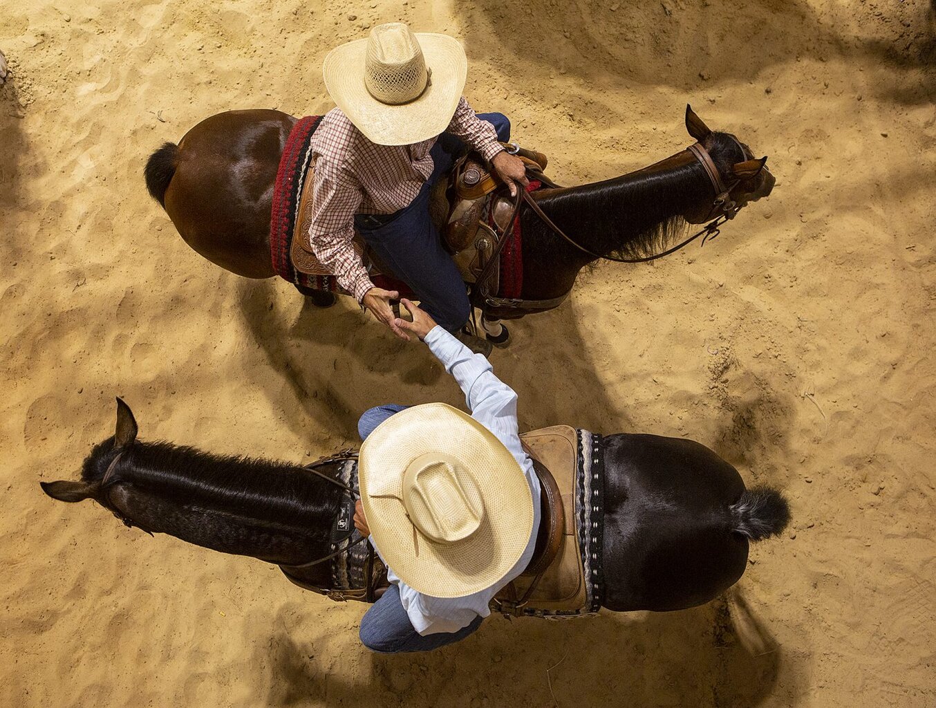 handshake-cowboys-1536x1162-1524863333.jpg