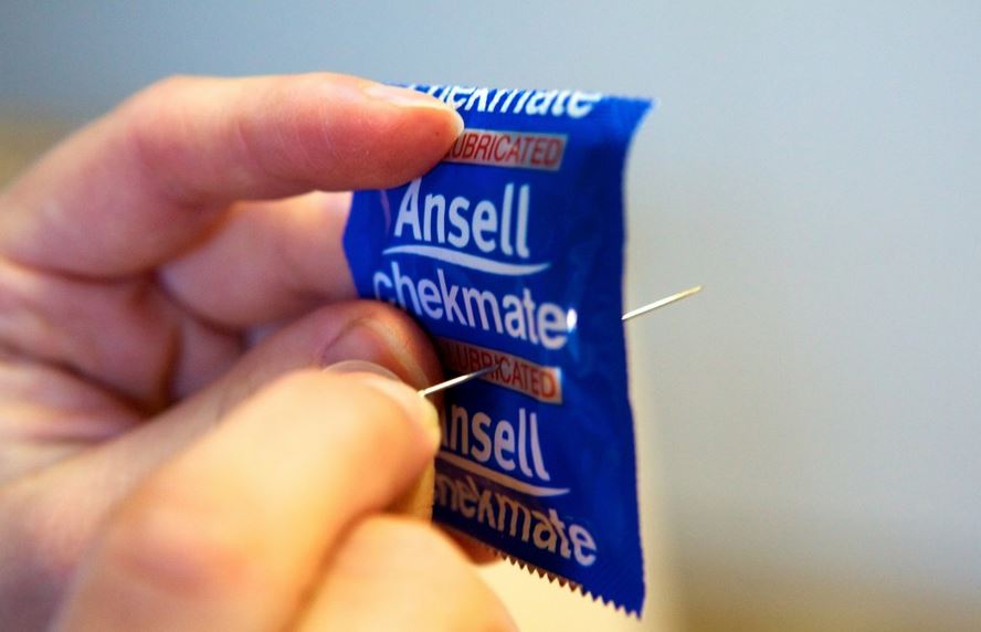 pin and condom.JPG