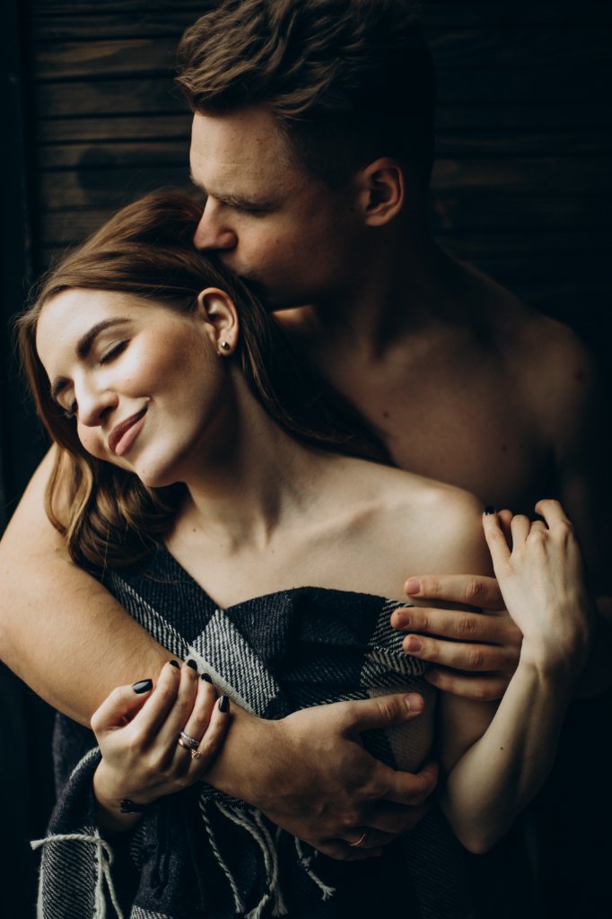 young-couple-together-blanket-home.jpg