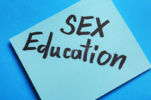 note-phrase-sex-education-blue-background-top-view-note-phrase-sex-education-blue-background-1...png