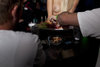 topless girl serving finger food