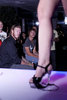 long legs in high heels standing on bar counter