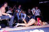 naked Blonde crawling in front of group of guys