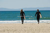 Woman-Man-20s-Surfers-walking-with-Surfboard.jpg