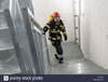 rottweil-germany-16th-september-2018-a-fireman-in-full-equipment-walks-up-the-steps-from-the-t...jpg